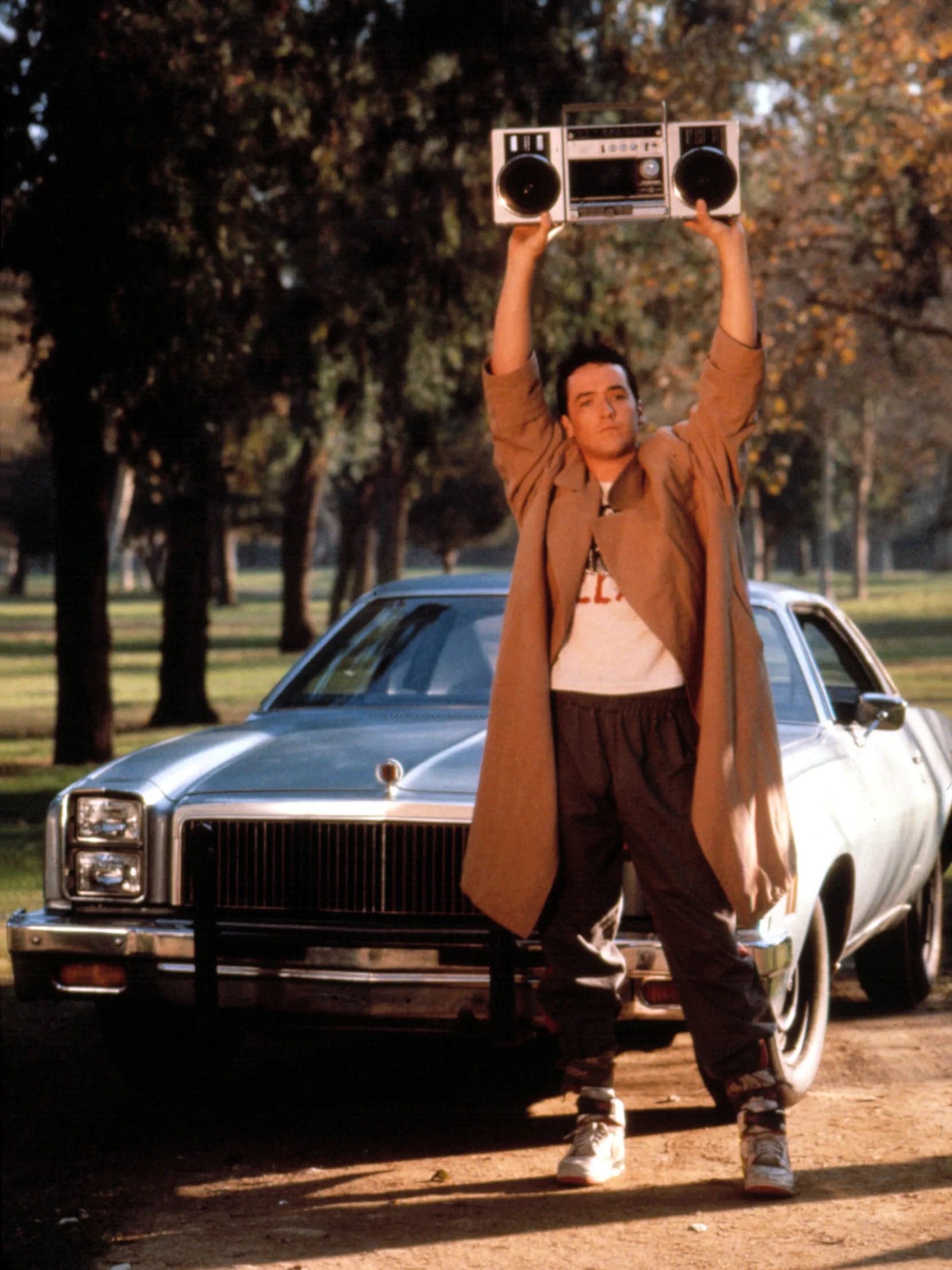 John Cusack hoists a boombox over his head and uses it to play Peter Gabriel's "In Your Eyes." The scene is from the movie "Say Anything."