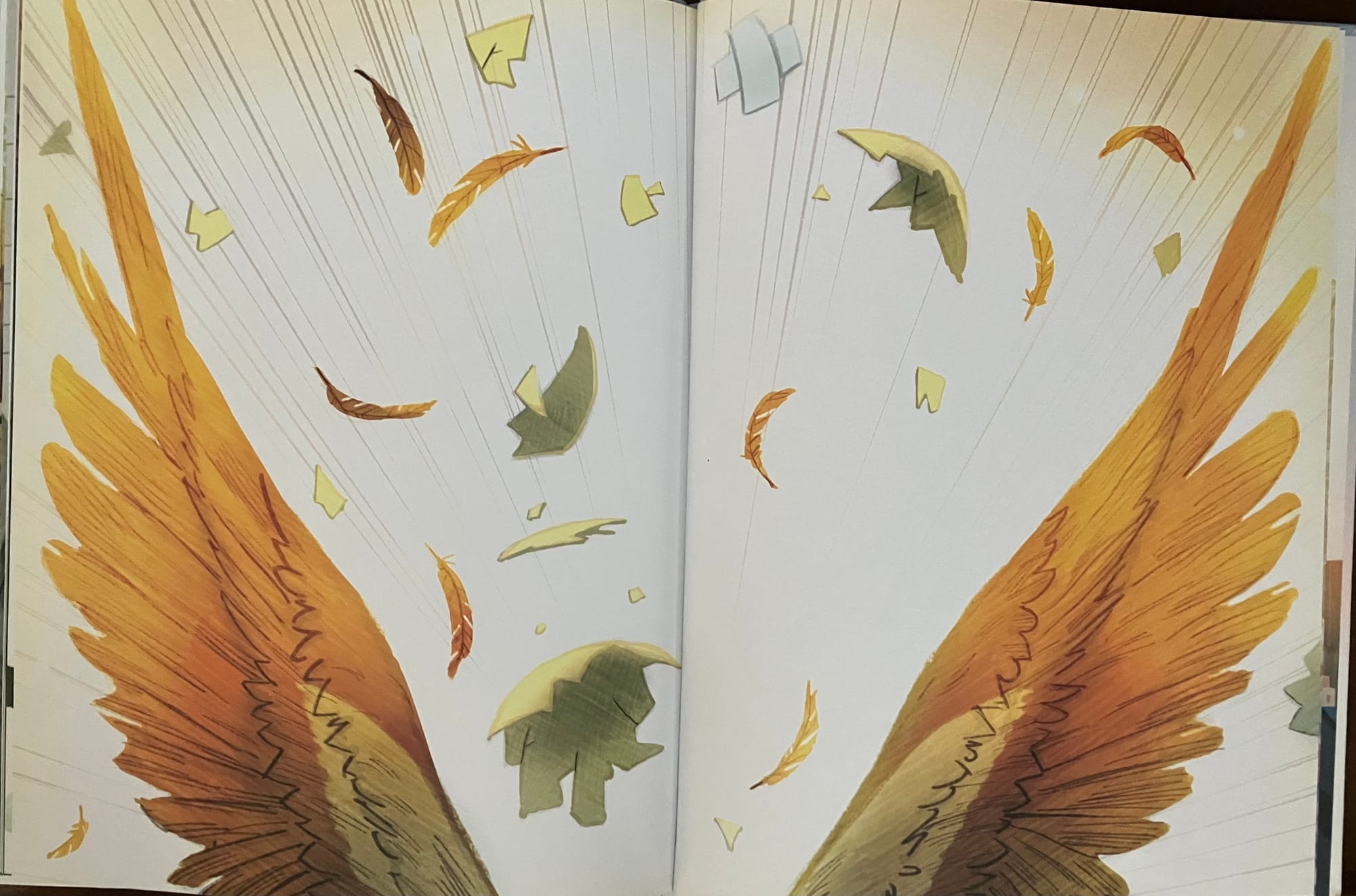 An open book with wings and feathers.