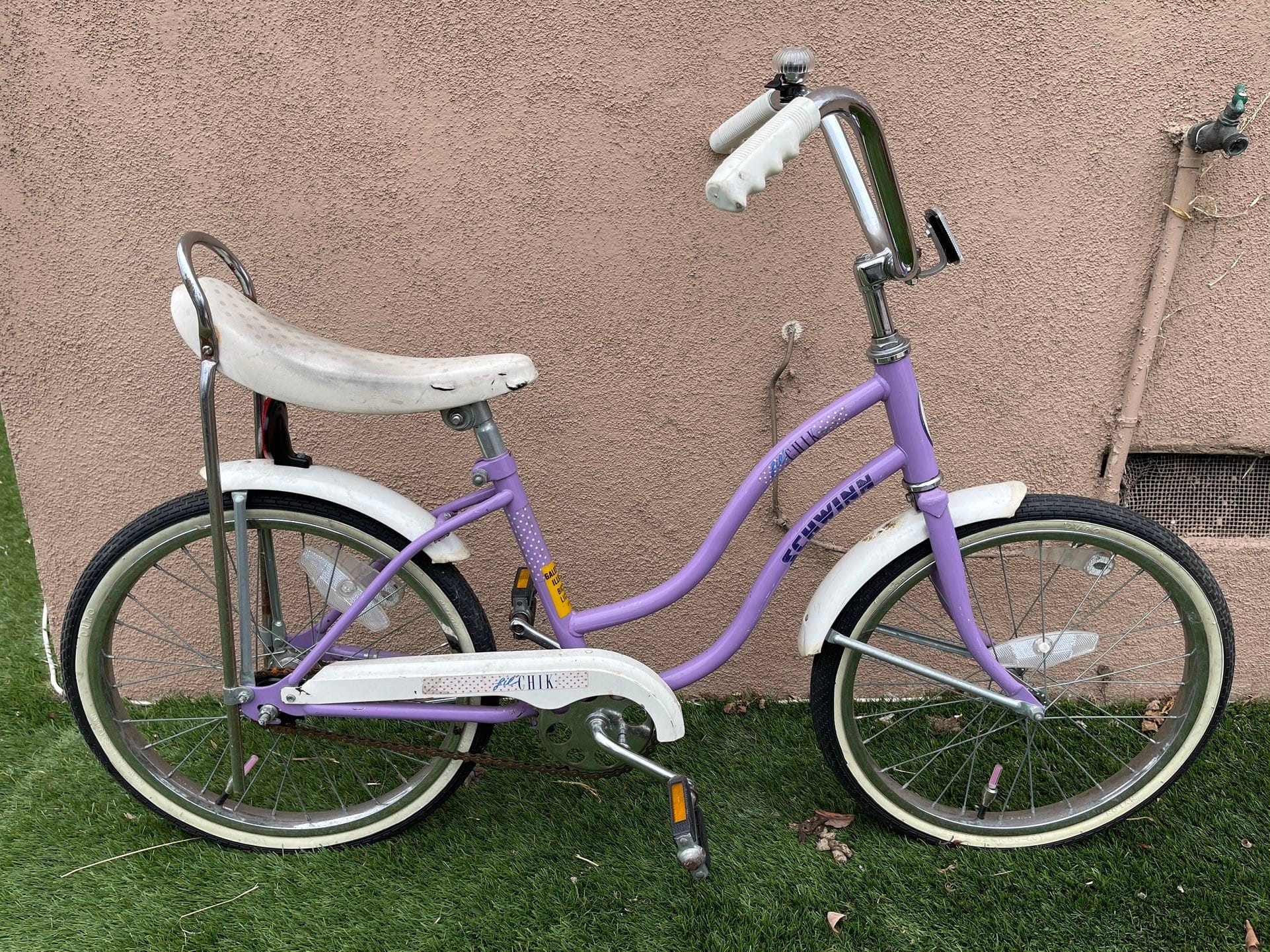 A purple Schwinn "Lil Chik" bicycle.