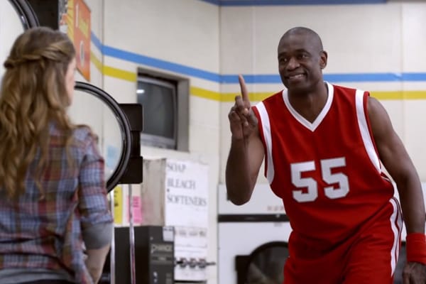 Known NBA shot-blocker Dikembe Mutombo wags his finger and says "Not in my house!" 